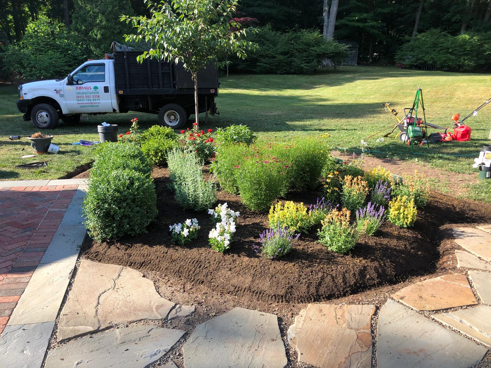 Full garden bed installation with mixed perennials and shrubs