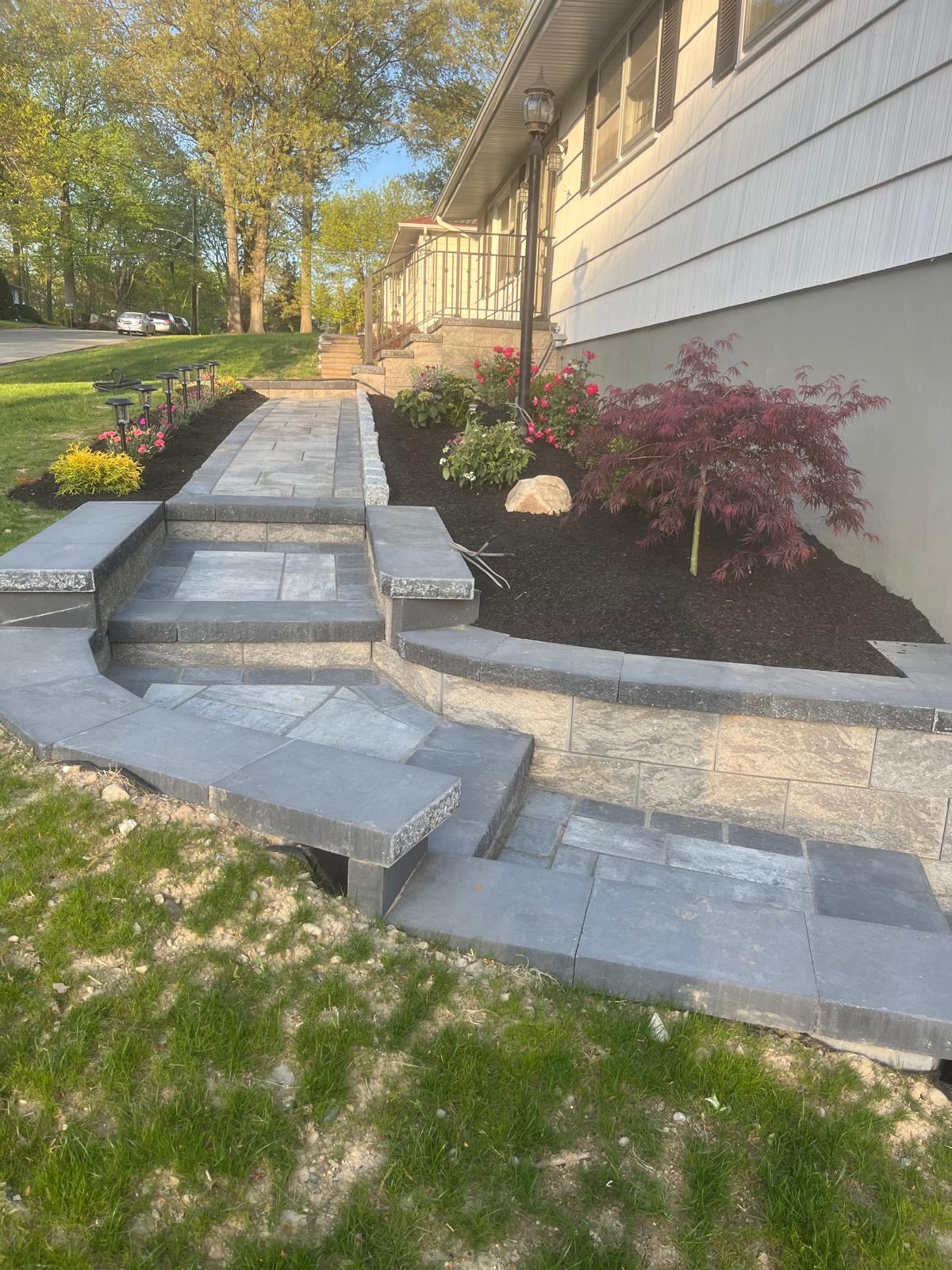 Bluestone steps and retaining wall with fresh mulch bed