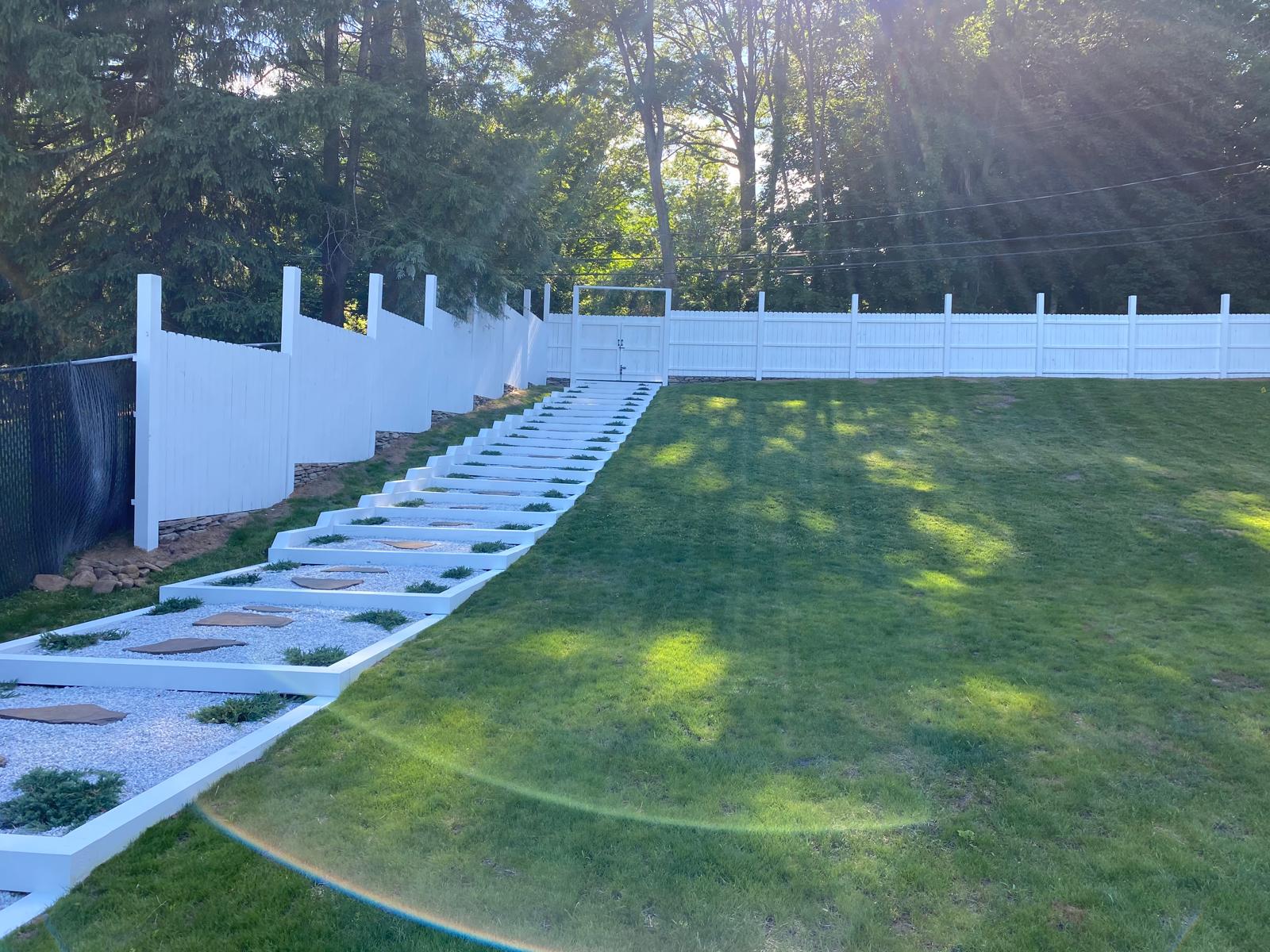 Completed stone walkway with grass between pavers